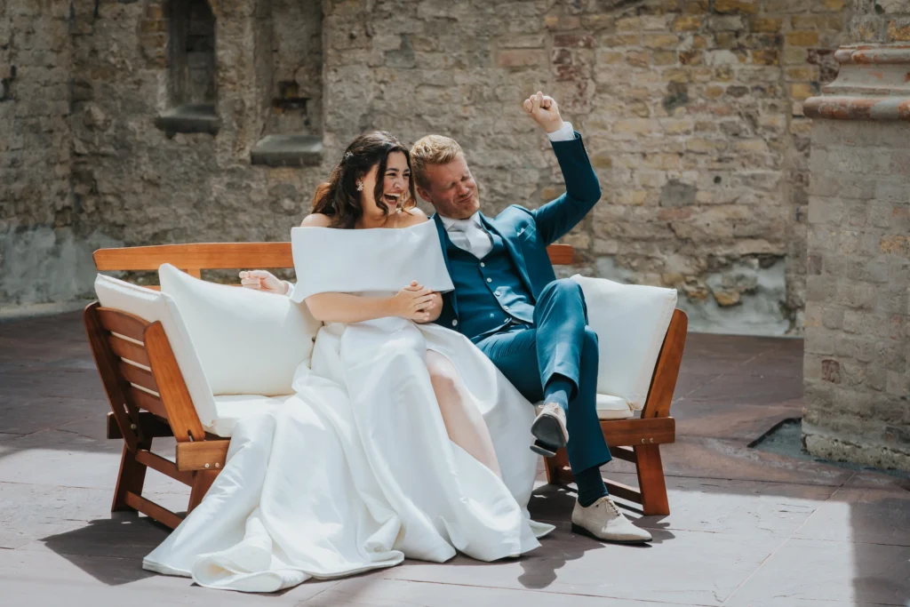 Black and white photo of person holding framed artwork